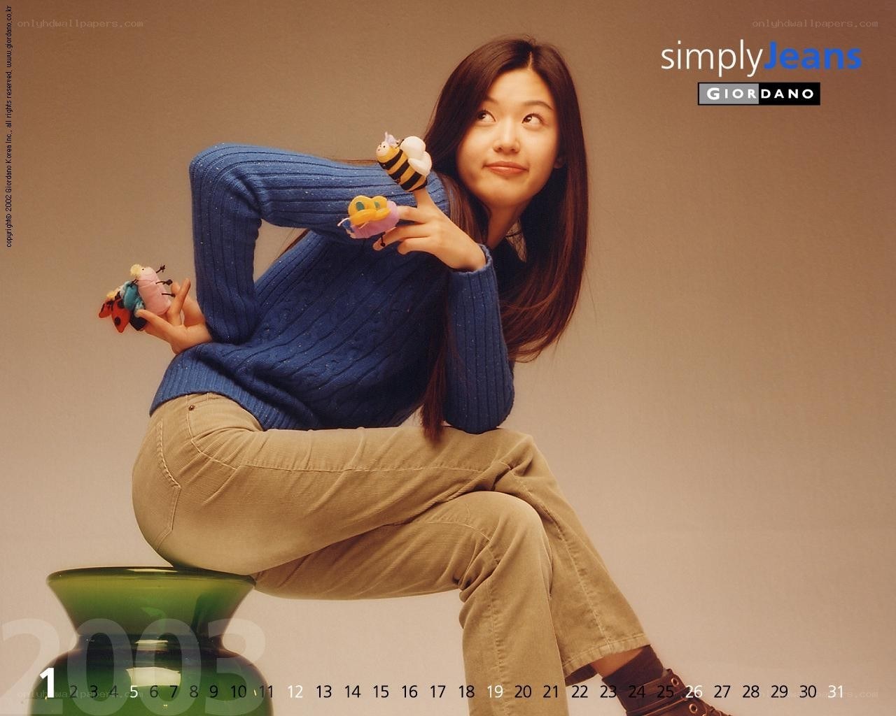 woman holding stuffed animals