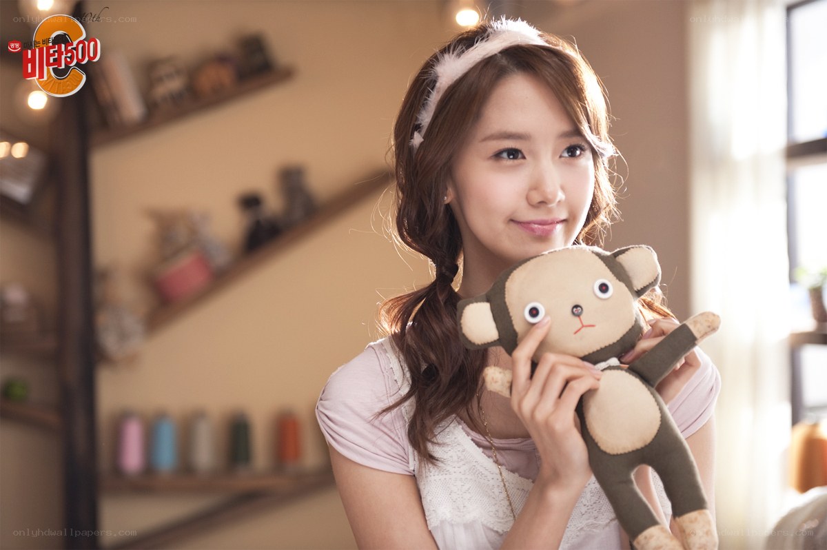 woman holding stuffed monkey