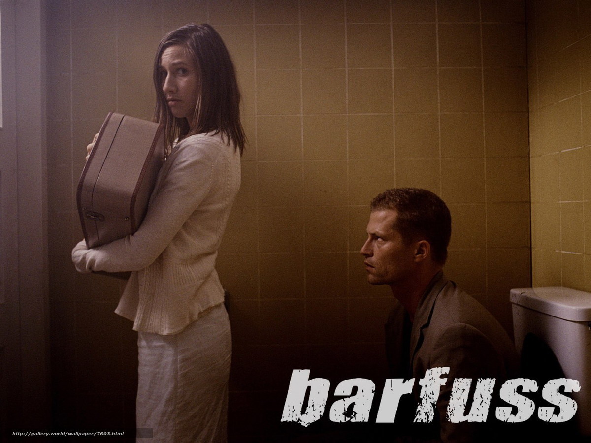 woman holding suitcase in bathroom