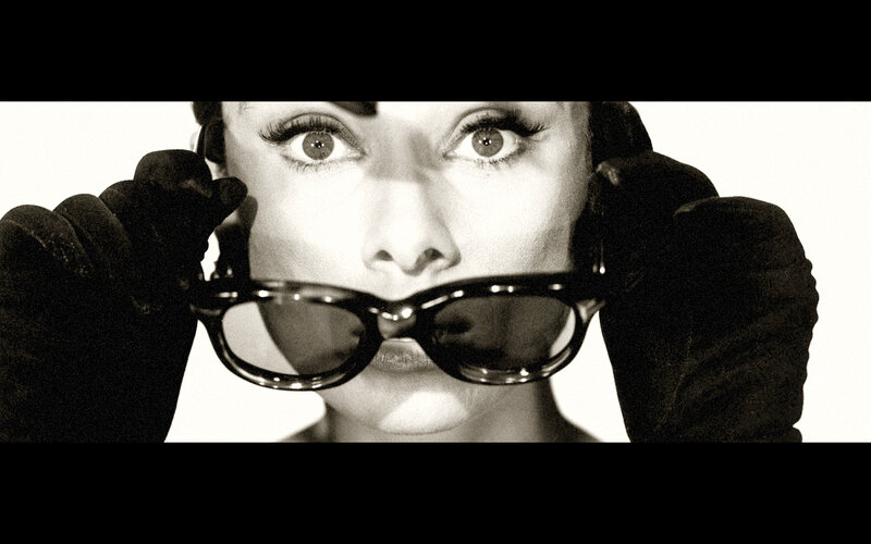 woman holding sunglasses