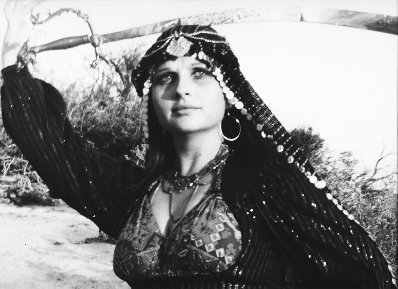 woman holding sword in desert