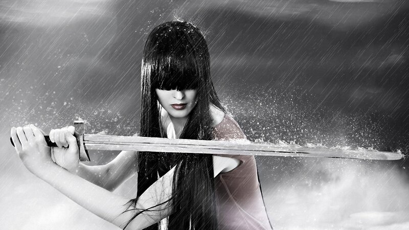 woman holding sword in rain