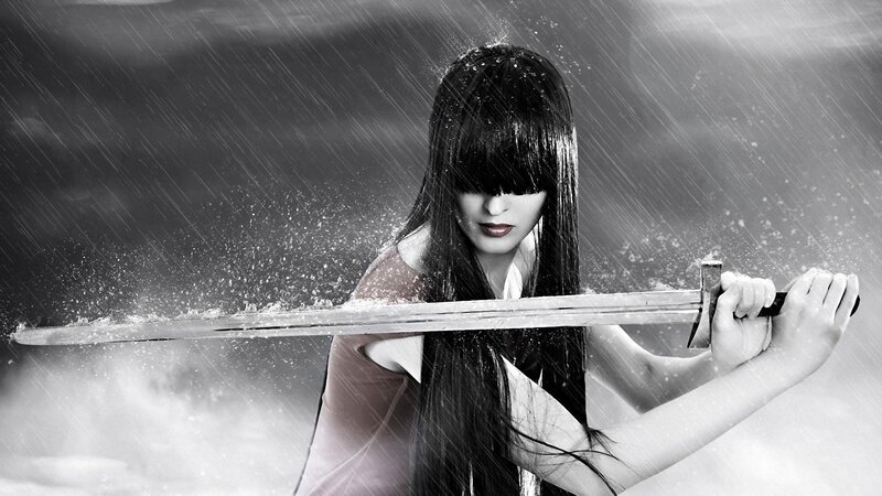 woman holding sword in rain