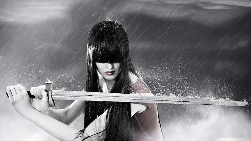 woman holding sword in rain