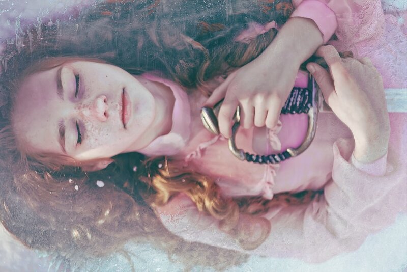 woman holding sword underwater