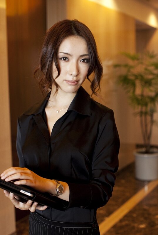 woman holding tablet in office