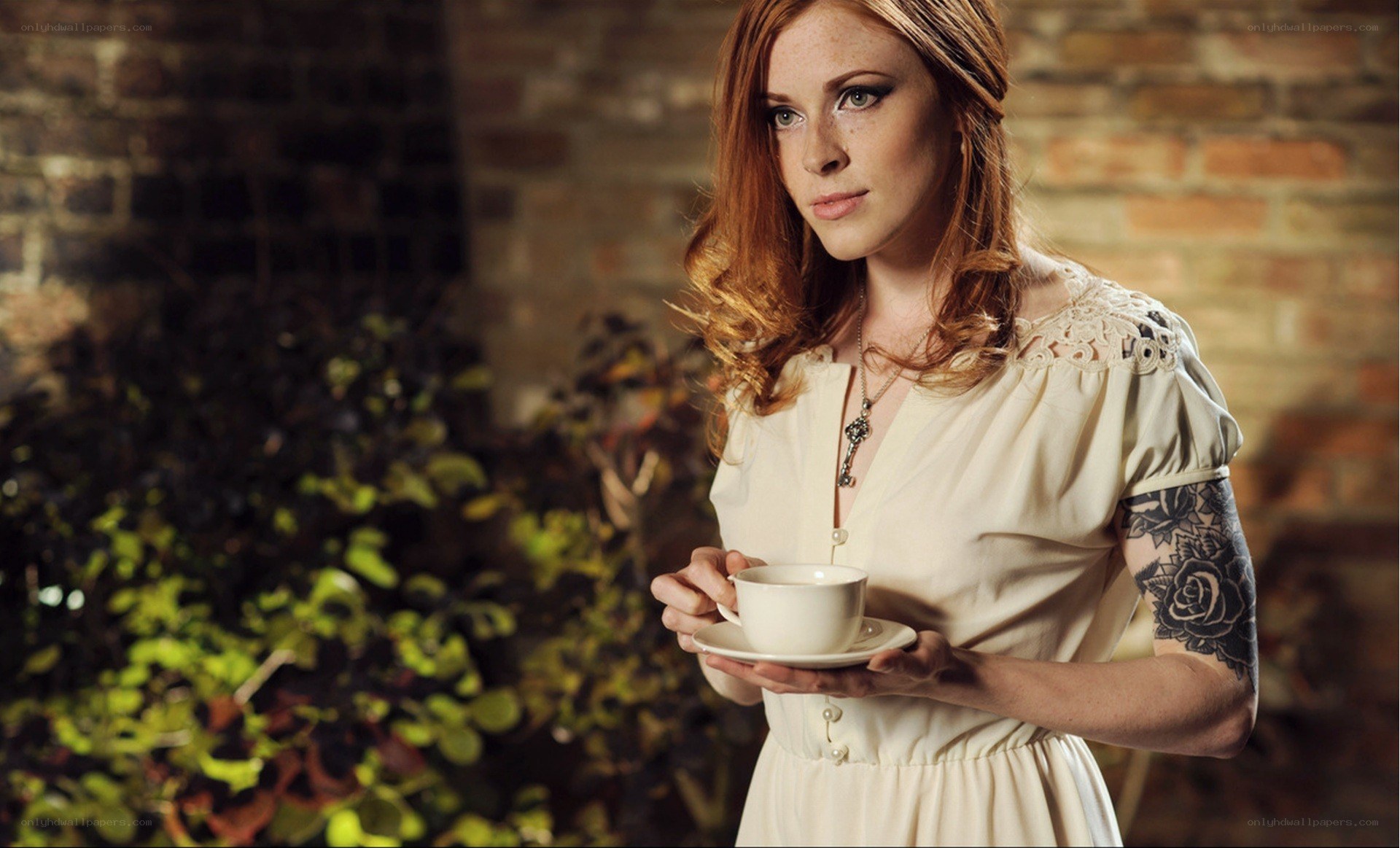 woman holding tea cup