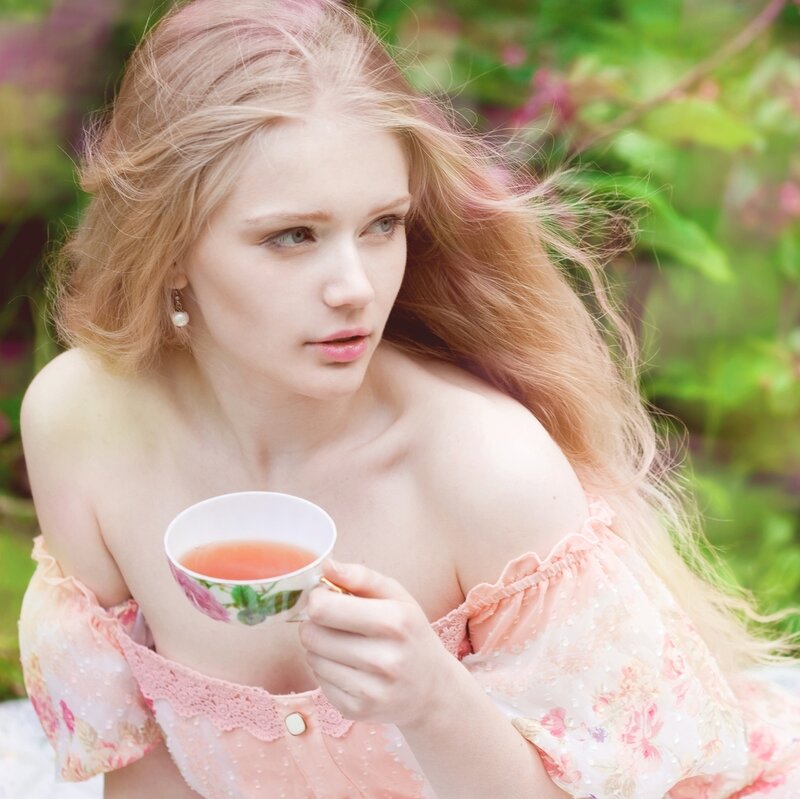 Woman Holding Tea Cup — Pink