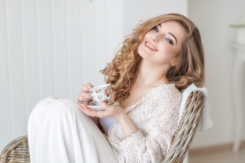 Woman Holding Teacup — White, Serene