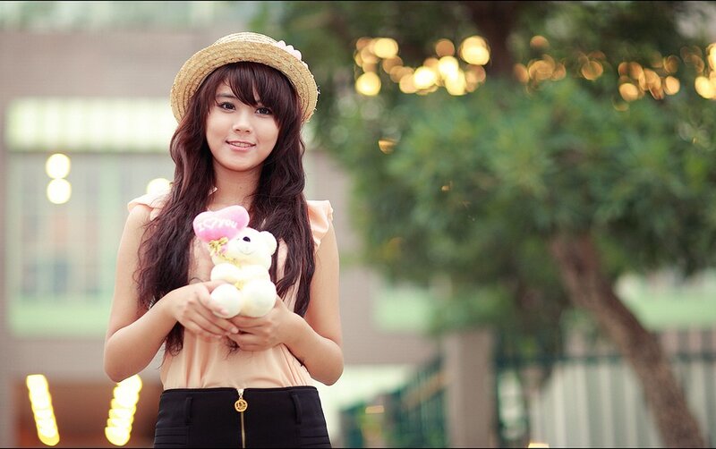 Woman holding teddy bear
