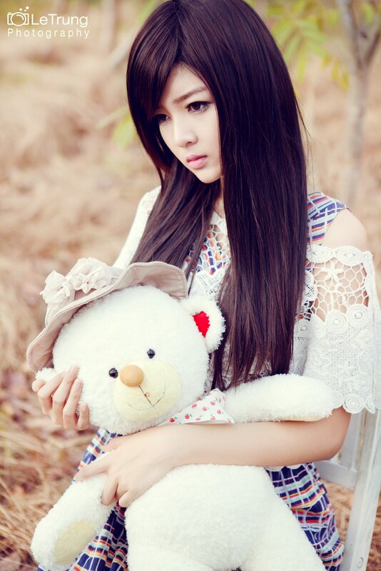 woman holding teddy bear