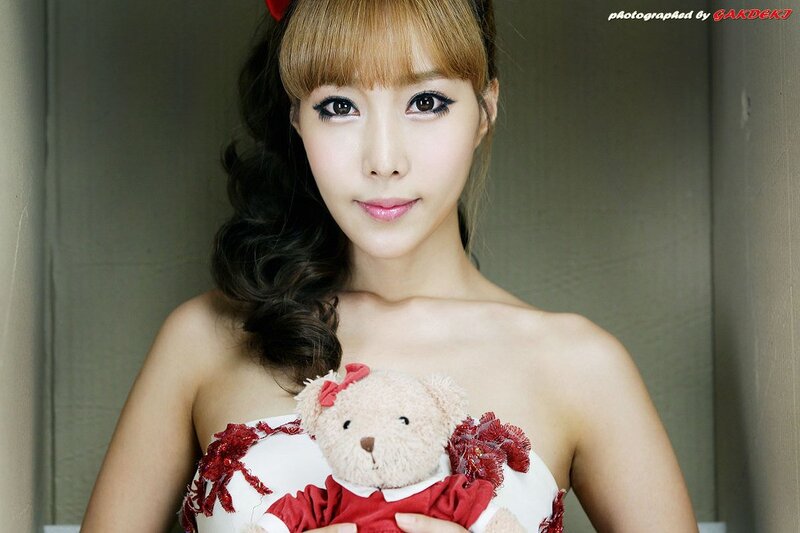 woman holding teddy bear