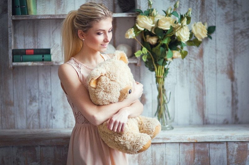 Woman Holding Teddy Bear — Beige, Calm