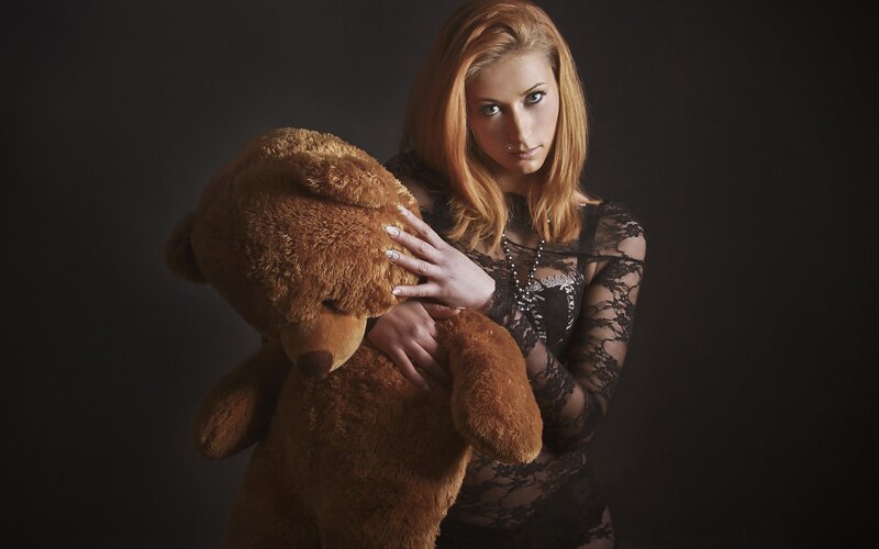 Woman Holding Teddy Bear — Black, Dramatic, Photograph