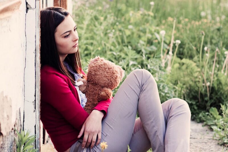 Woman Holding Teddy Bear — Red
