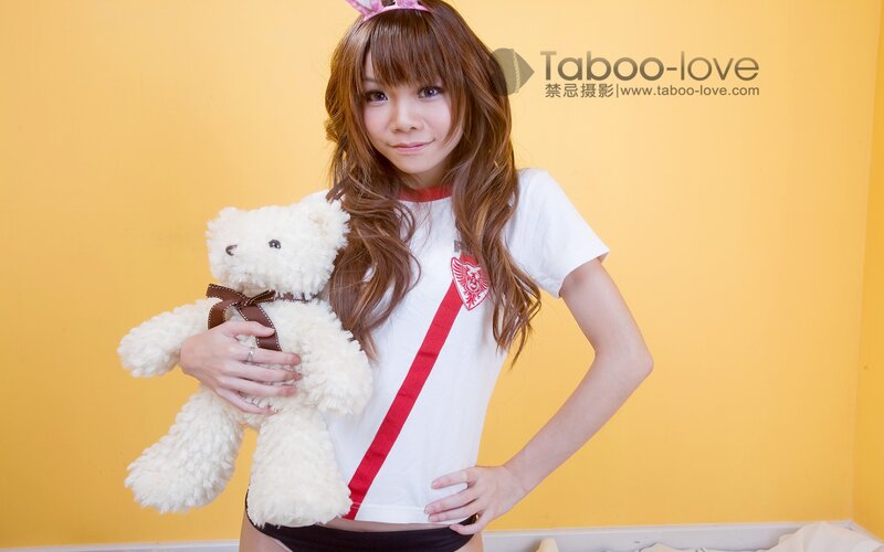 Woman Holding Teddy Bear — Yellow, Playful