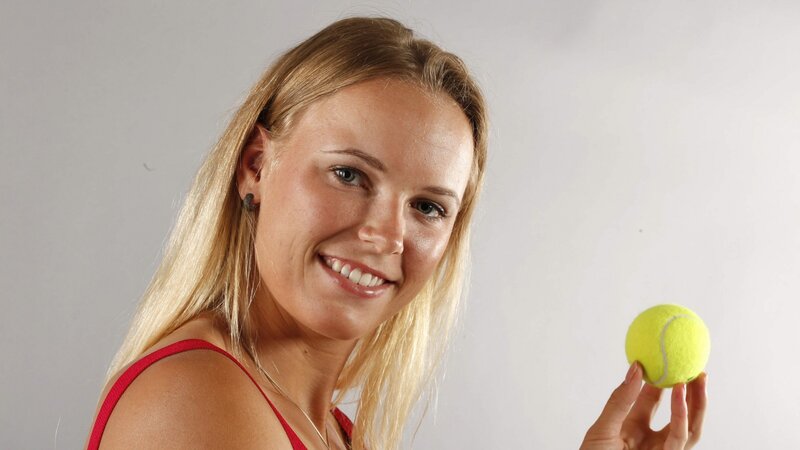 woman holding tennis ball