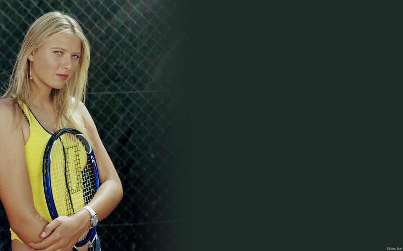 woman holding tennis racket