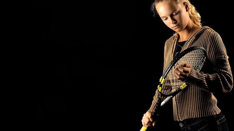 woman holding tennis racket