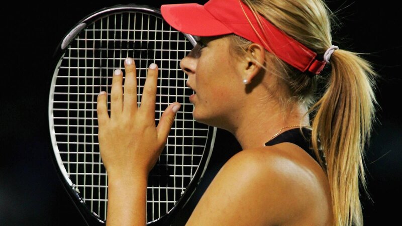 Woman Holding Tennis Racket — Black, Focused