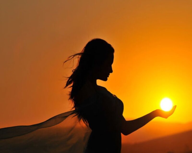 woman holding the sun