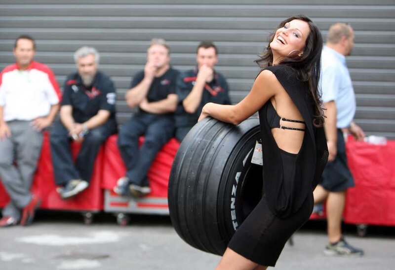 Woman Holding Tire