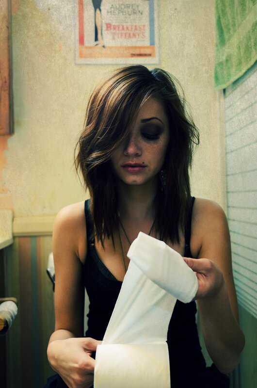 woman holding toilet paper