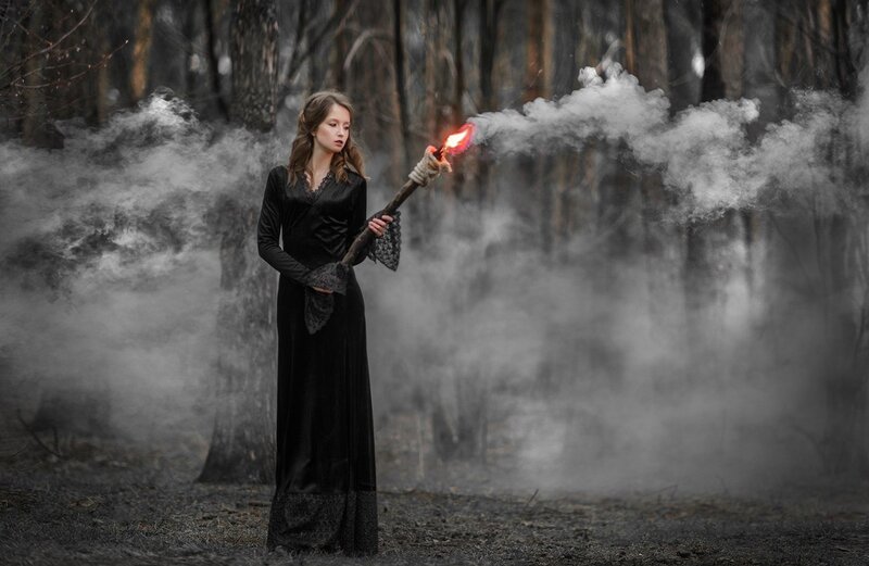 Woman Holding Torch — Black, Dramatic
