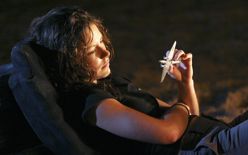 woman holding toy airplane