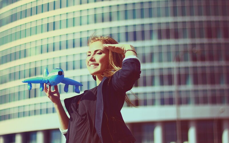 woman holding toy airplane