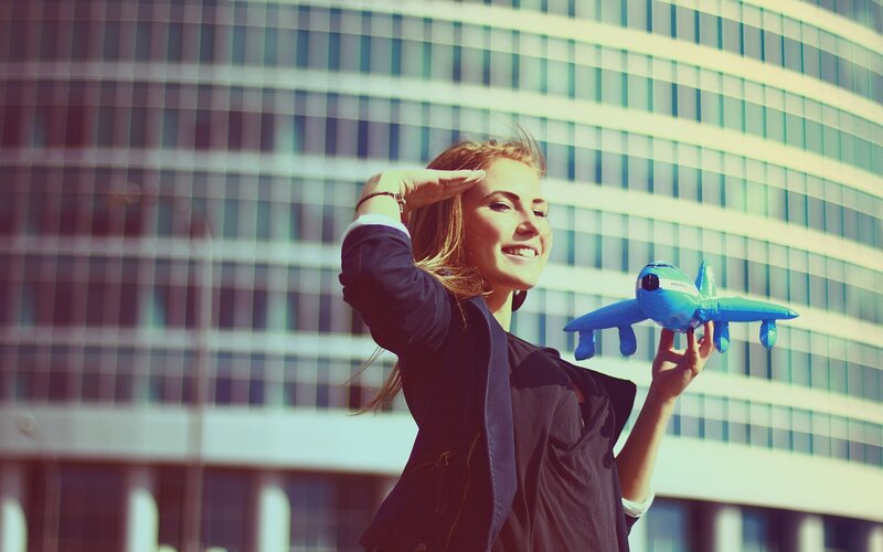 woman holding toy airplane