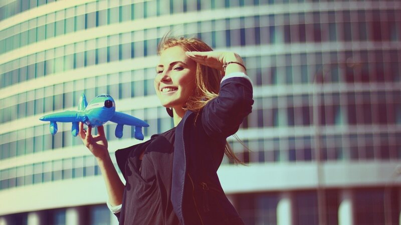 Woman holding toy airplane
