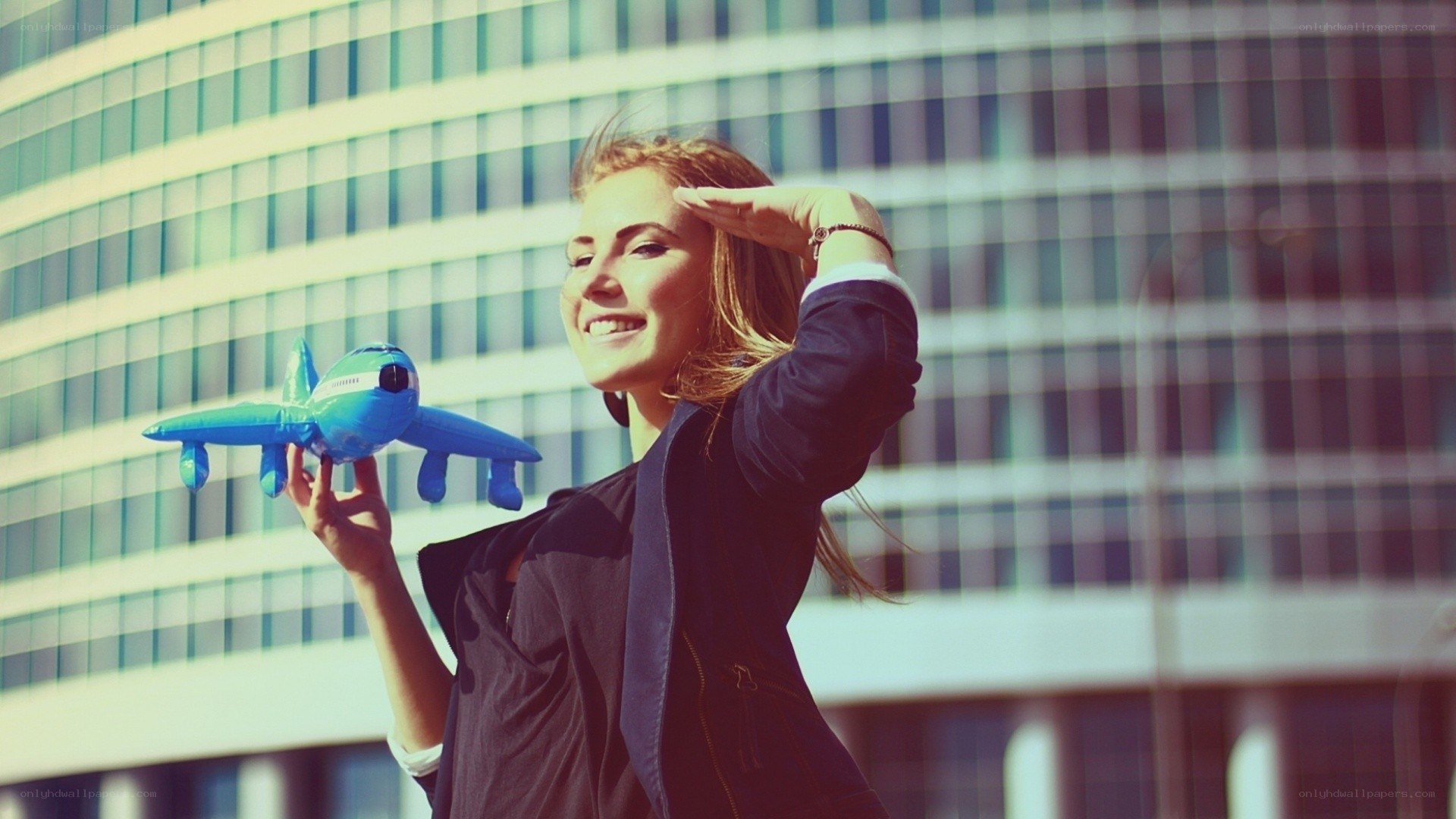 Woman holding toy airplane