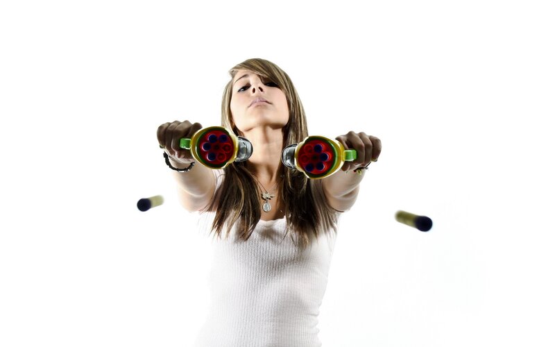 woman holding toy guns