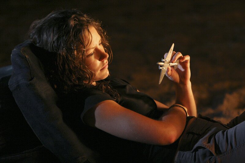 woman holding toy plane