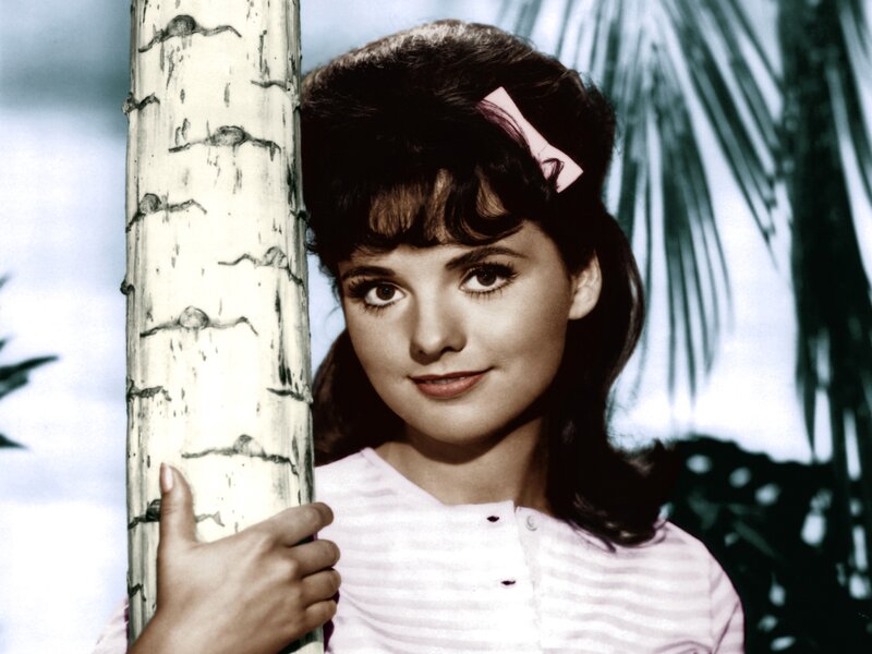 Woman Holding Tree Trunk