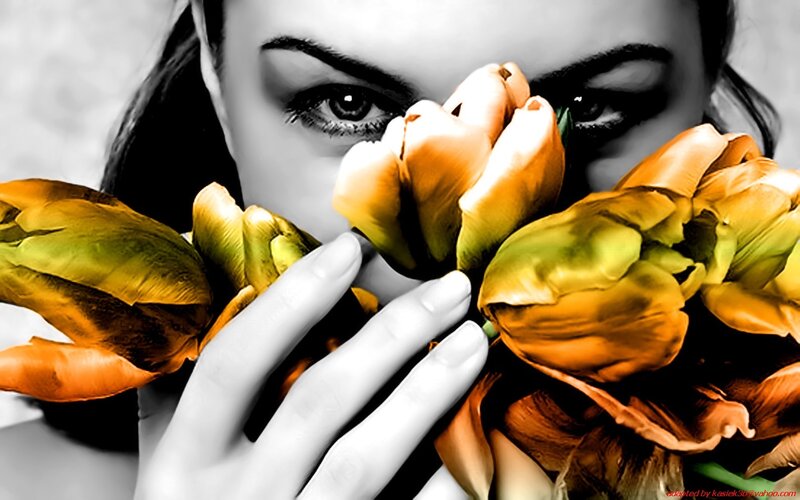 woman holding tulips close