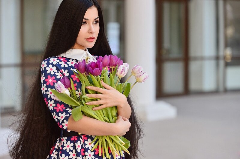 Woman Holding Tulips — Purple