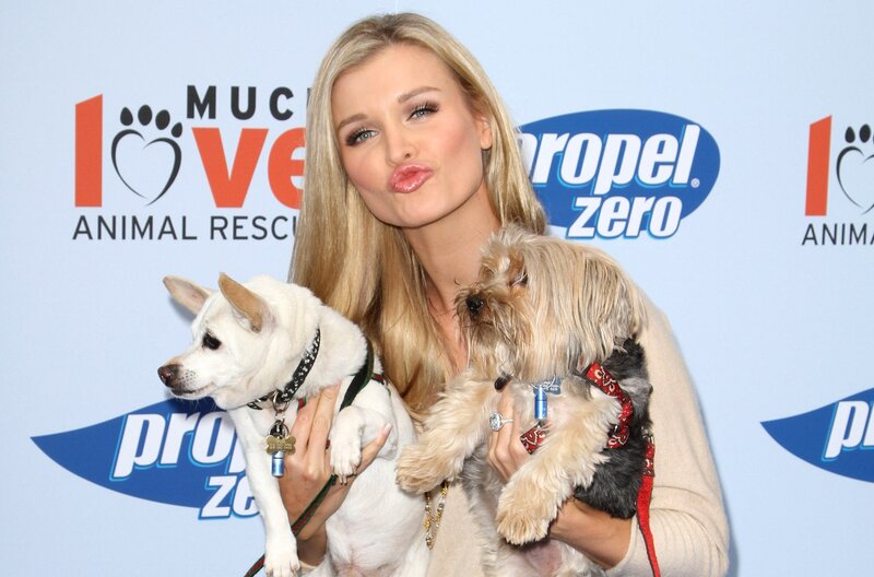 Woman Holding Two Dogs