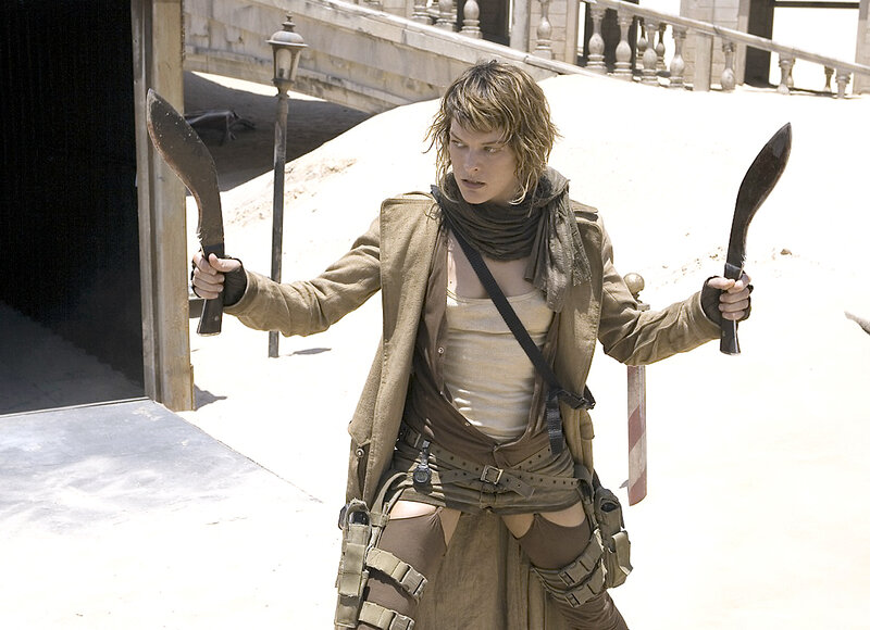 Woman holding two knives