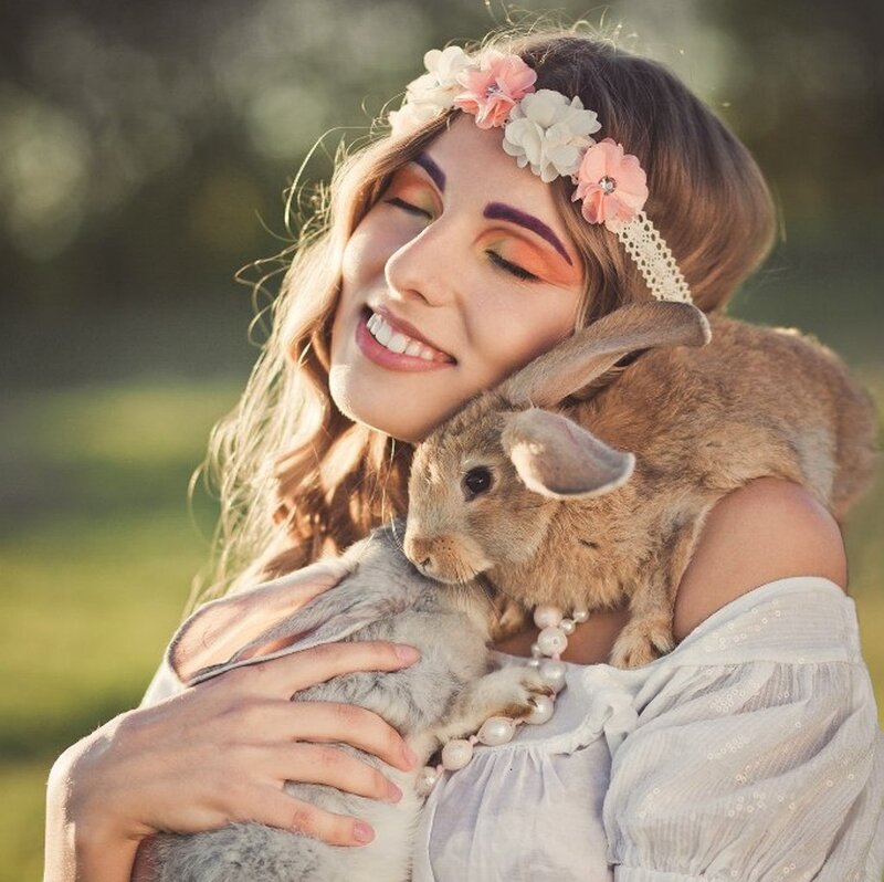 Woman Holding Two Rabbits