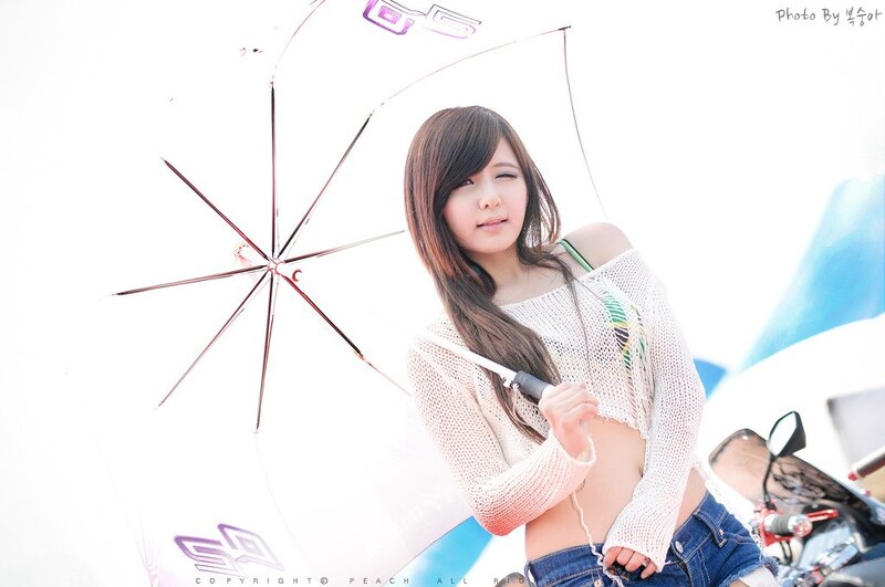 woman holding umbrella at event