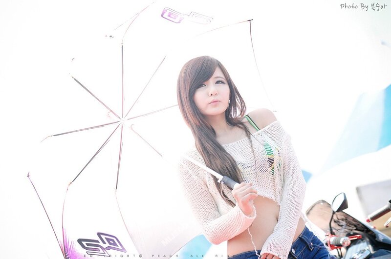 woman holding umbrella at event