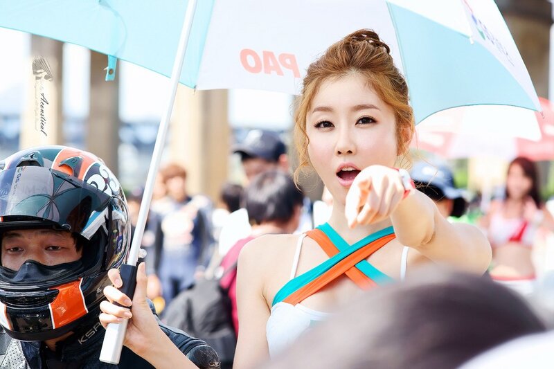 Woman holding umbrella at event