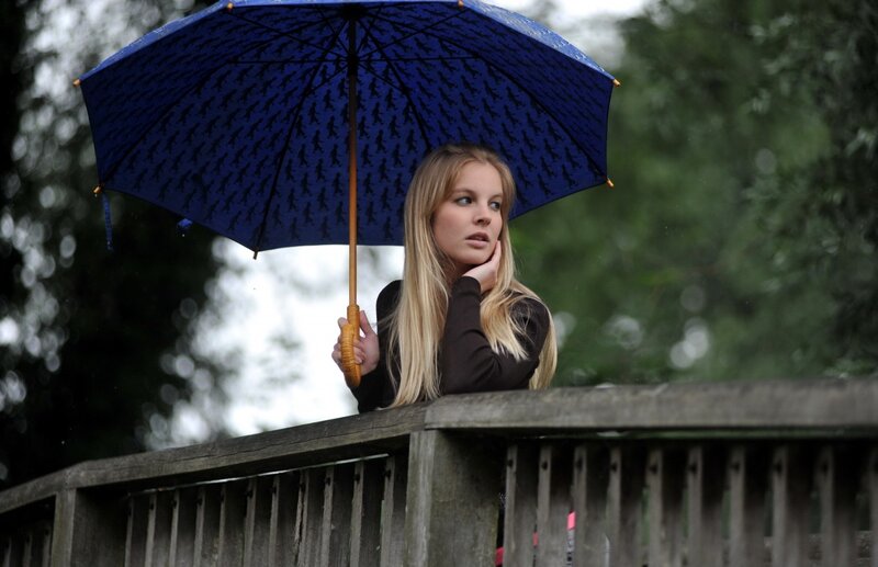 Woman Holding Umbrella — Blue, Contemplative