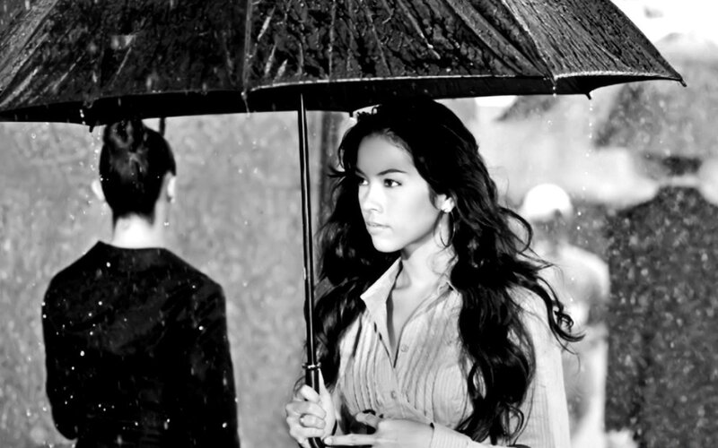 woman holding umbrella in rain