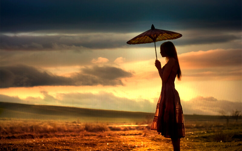 Woman Holding Umbrella — Orange, Dramatic