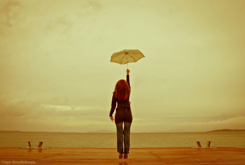 Woman Holding Umbrella — Yellow, Contemplative
