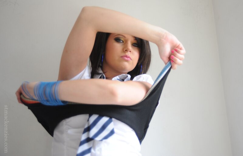 woman holding up shirt