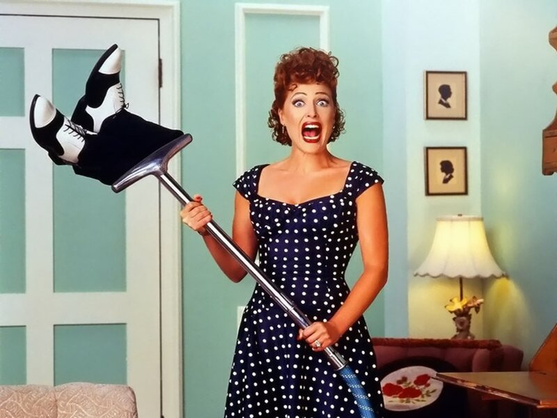 Woman Holding Vacuum Cleaner